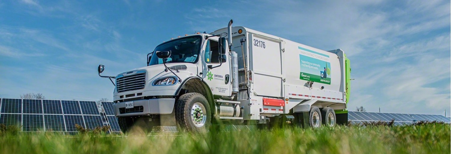 waste management truck with solar panels in back