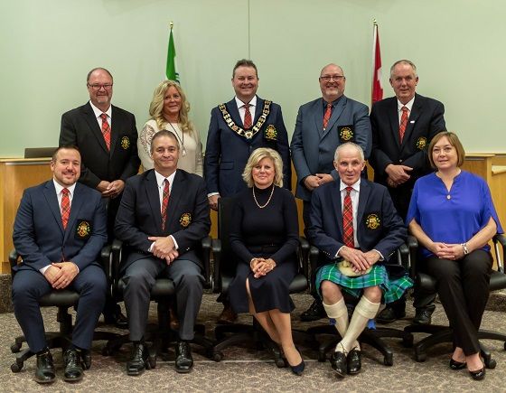 Group of councillors standing together in front of Council Chambers